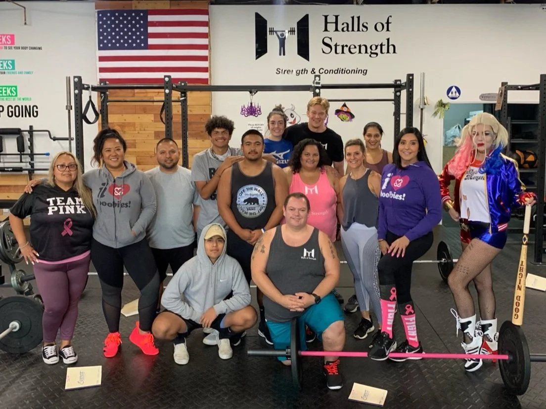Halls of Strength members and coaches together on the floor